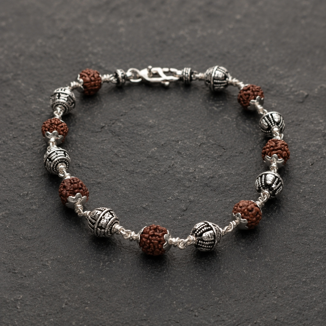 Close-up of 925 silver Shivling beads on Rudraksha bracelet