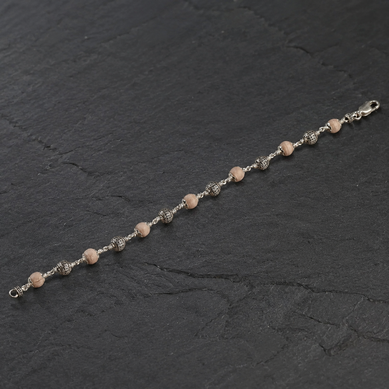Close-up of 925 silver textured beads and Tulsi bracelet