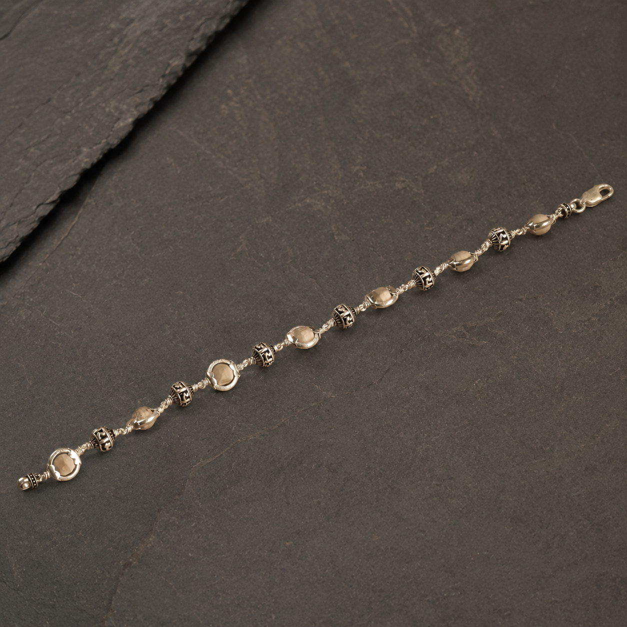 Close-up of Jay Shree Ram silver beads and Tulsi