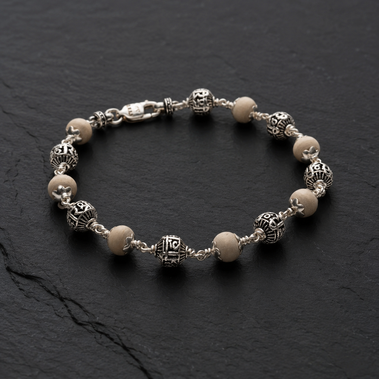 Close-up of Shree Hari silver beads on Tulsi bracelet