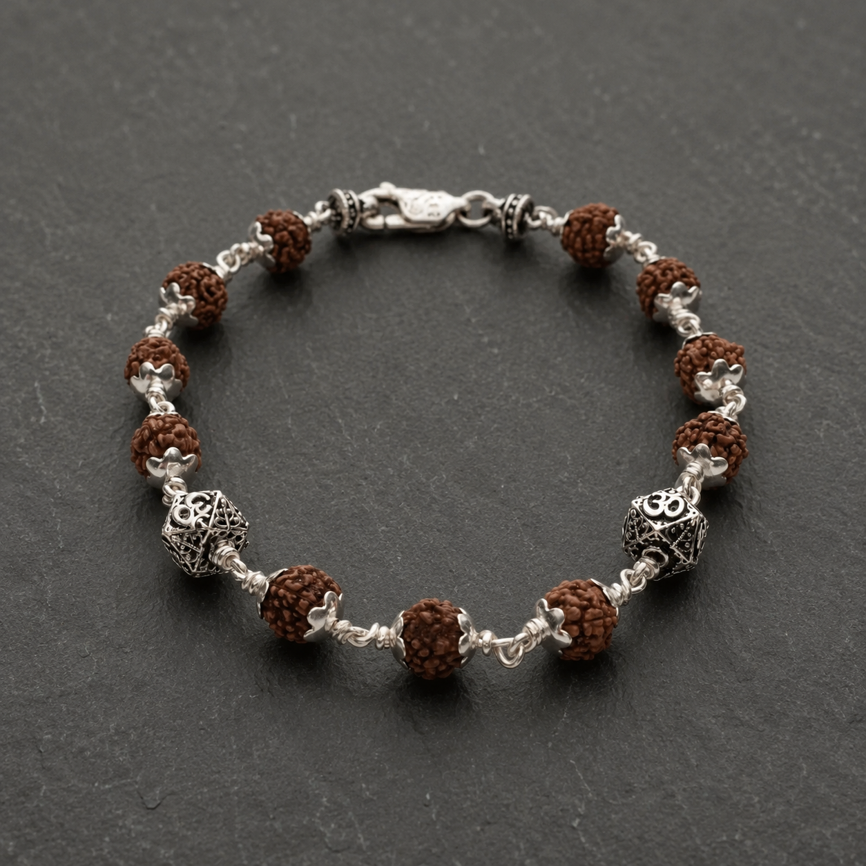 Close-up of antique-finished Hexagon Om beads in 925 sterling silver