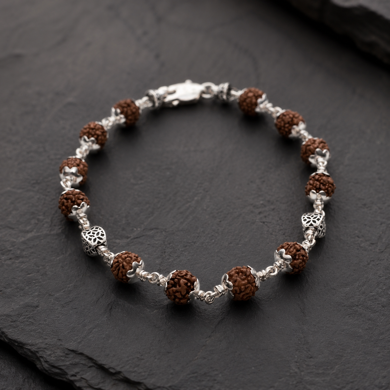 Close-up of intricately crafted hollow sterling silver beads