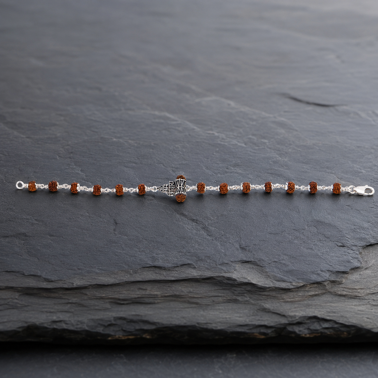 Front view of Om Namah Shivaya bracelet with Rudraksha beads and silver wire