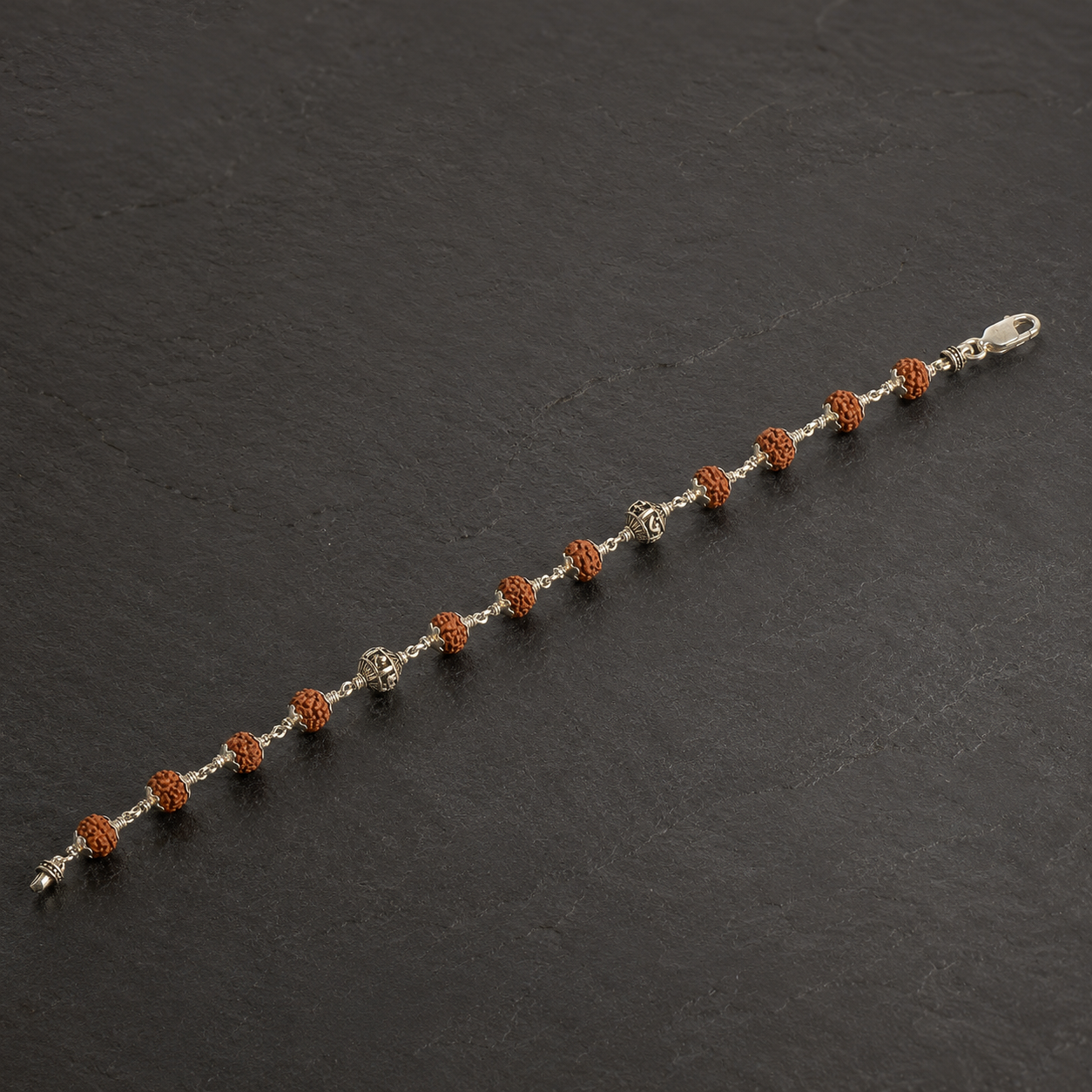 Full view of handcrafted Rudraksha and silver Ram Naam bracelet