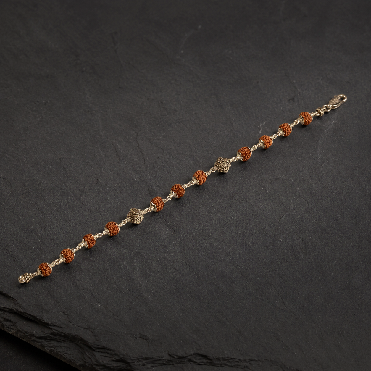 Full view of natural Rudraksha and sterling silver Om bead bracelet for men