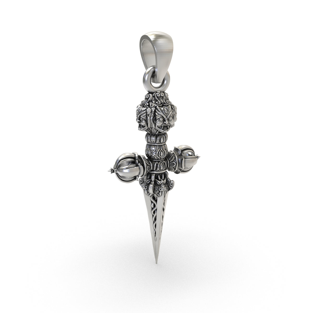 Phurba Vajra silver pendant shown beside measurement scale for size reference