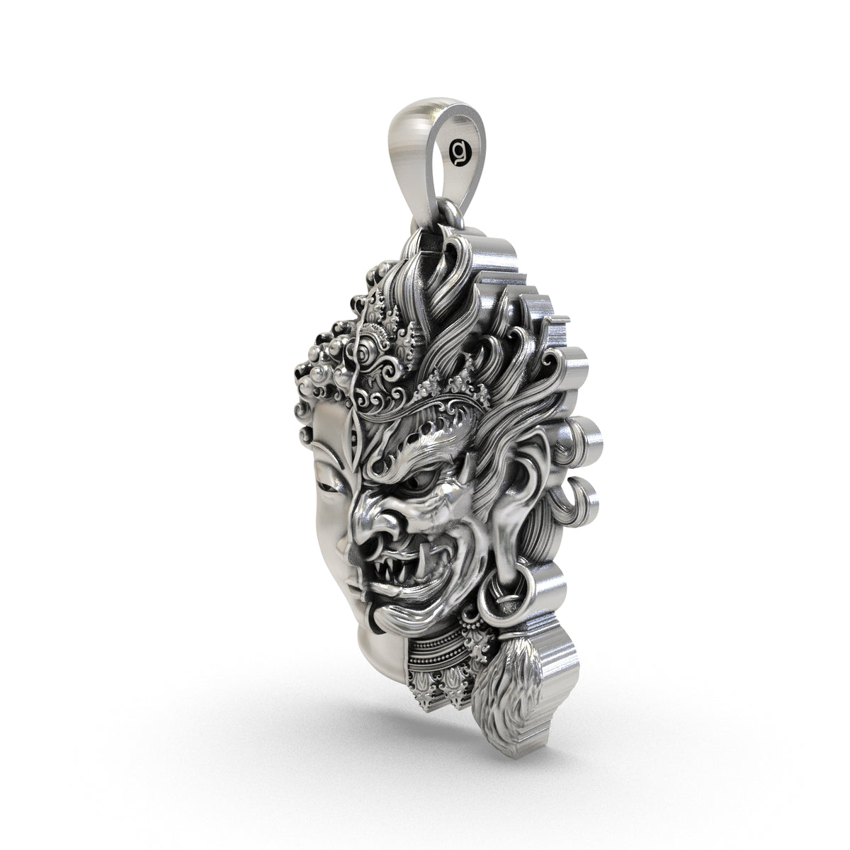 Close-up of the Buddha and fierce face carving with antique oxidized silver details