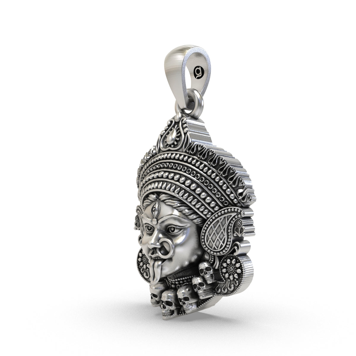 Angled view of the antique oxidized Kali Maa silver face pendant showing its relief details