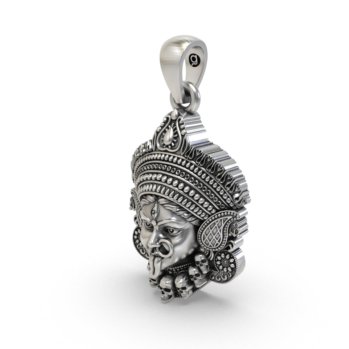 Detailed view of the ornamental crown on the antique silver Mahakali face pendant