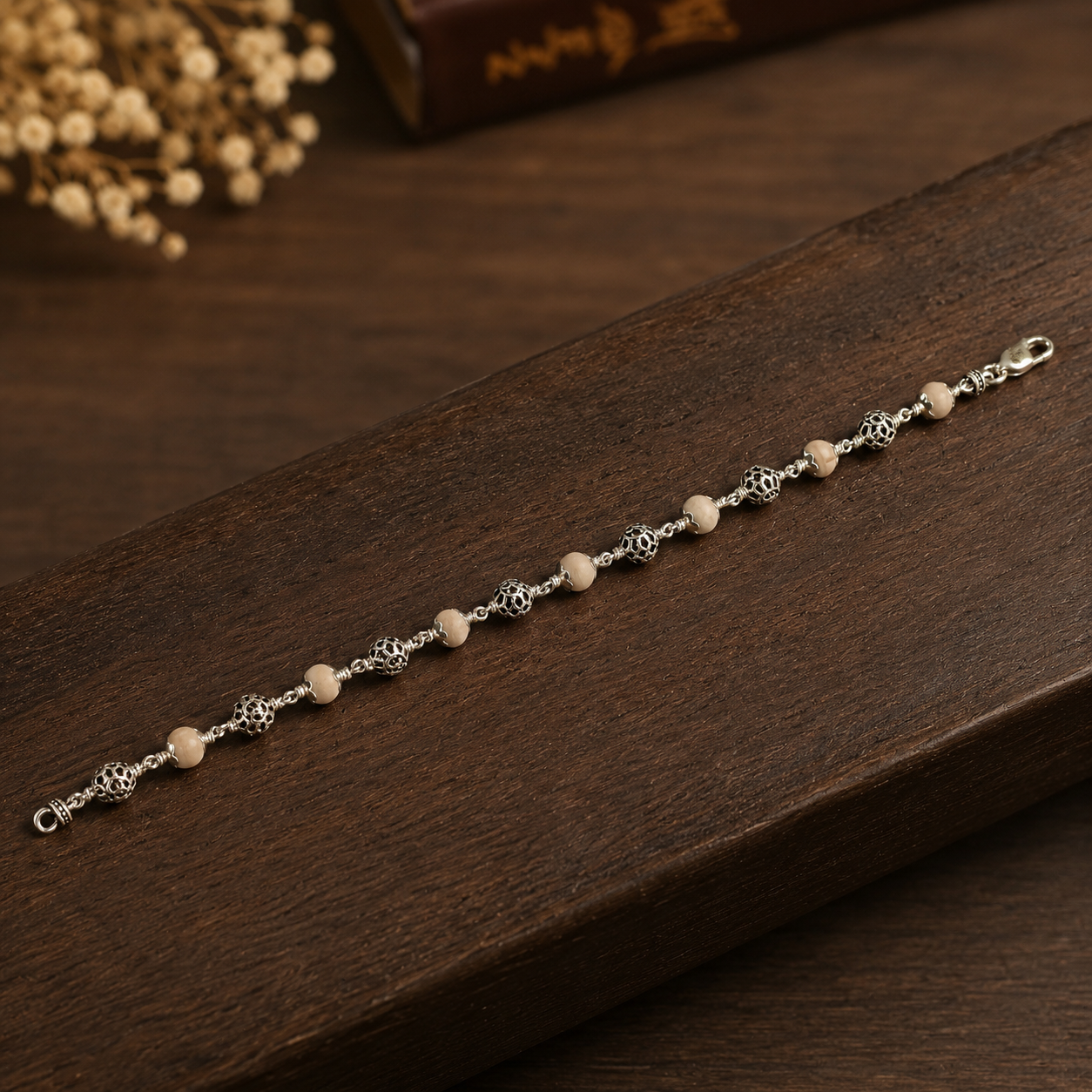 Handcrafted Tulsi bracelet showing 925 silver Om beadwork