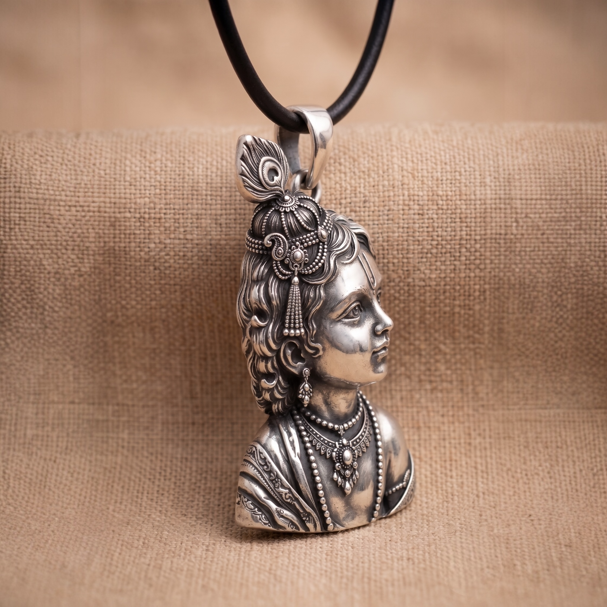 Close-up of Laddu Gopal silver pendant craftsmanship