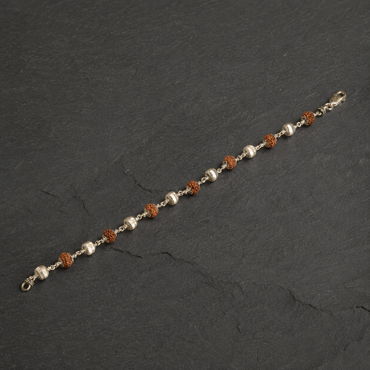 Panchmukhi Rudraksha and cylindrical silver bracelet front view