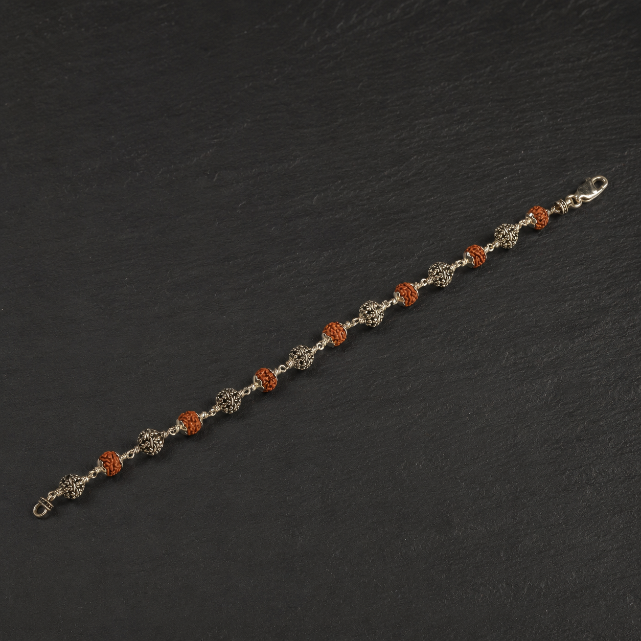 Panchmukhi Rudraksha and sterling silver flower bracelet front view