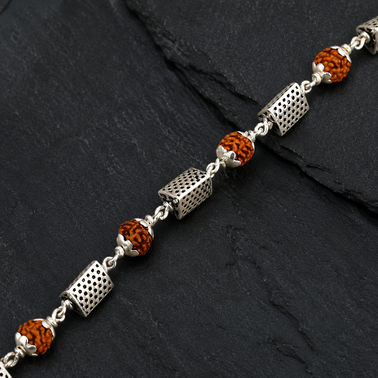 Rudraksha bracelet with seven triangle-shaped 925 silver beads
