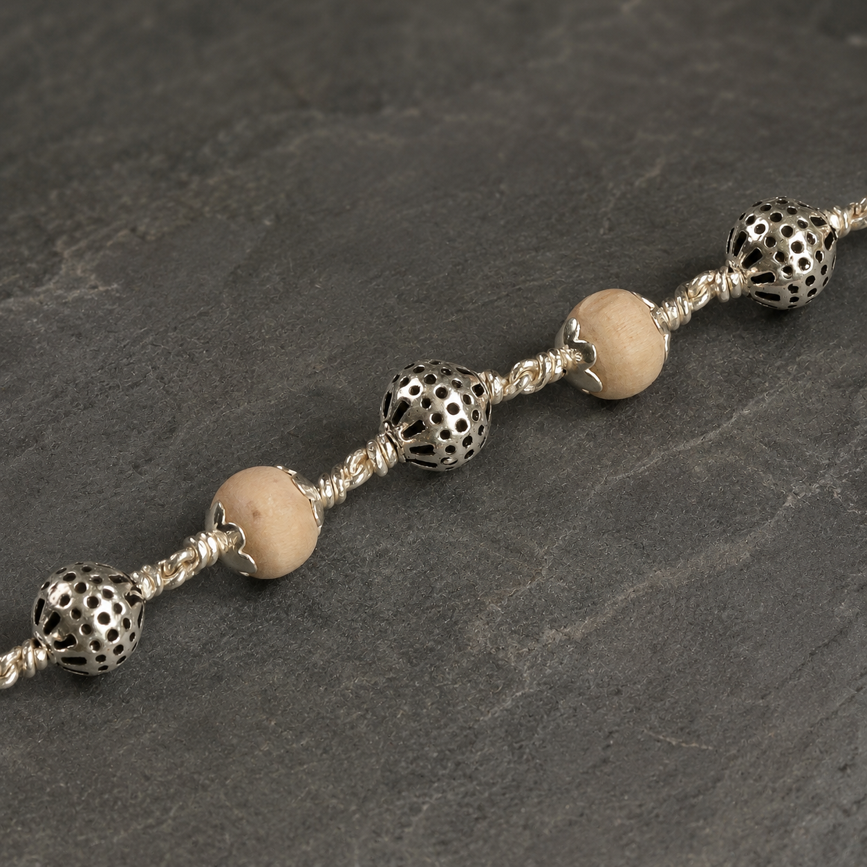 Tulsi bracelet with smooth 925 silver round beads