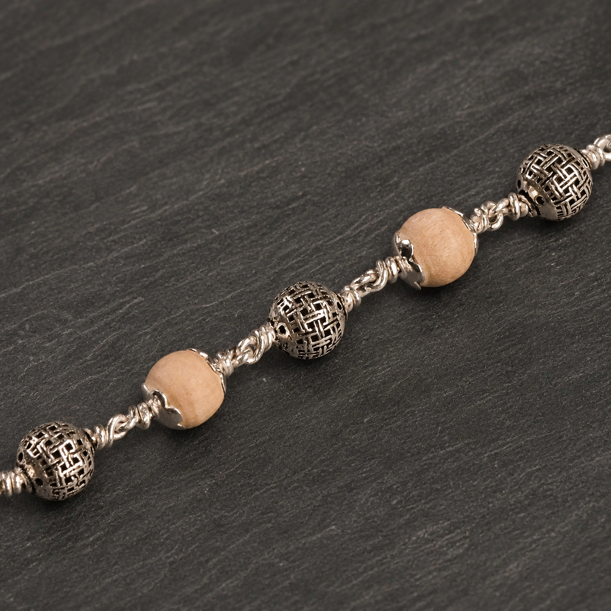 Tulsi bracelet with textured 925 silver round beads